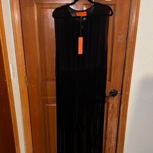 Sheer black top with fringe detail to the floor